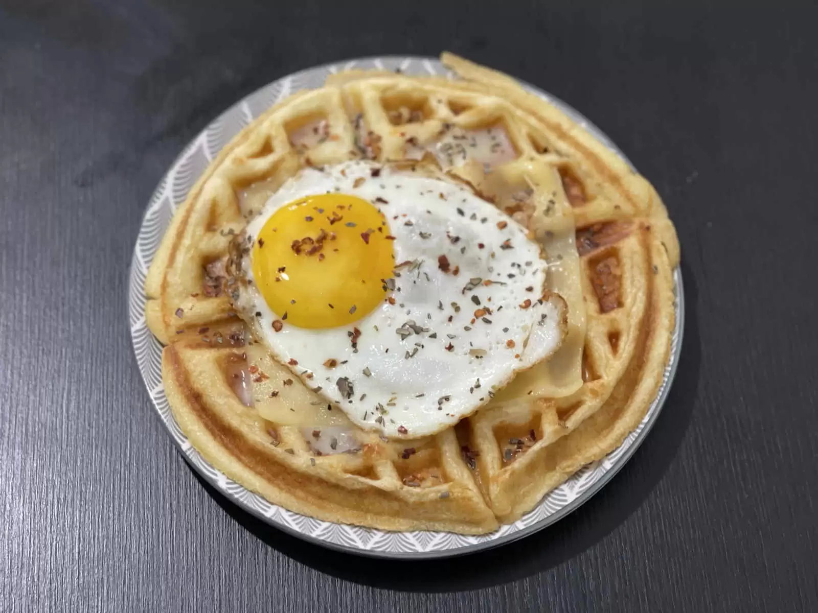 Tasty belgian waffle with egg and cheeses